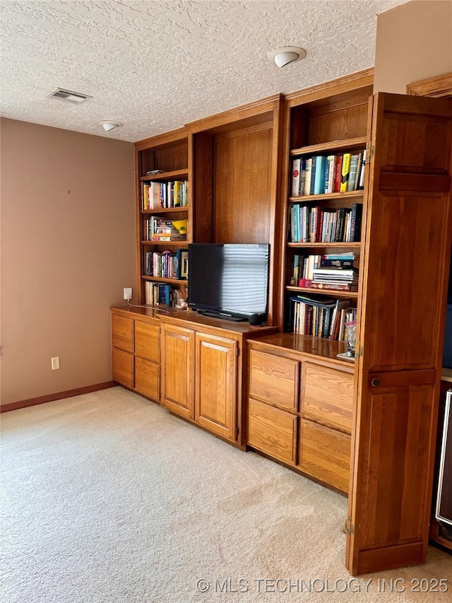 8448 S Florence Ave, Tulsa, OK 74137 - home office featuring light carpet and a textured ceiling