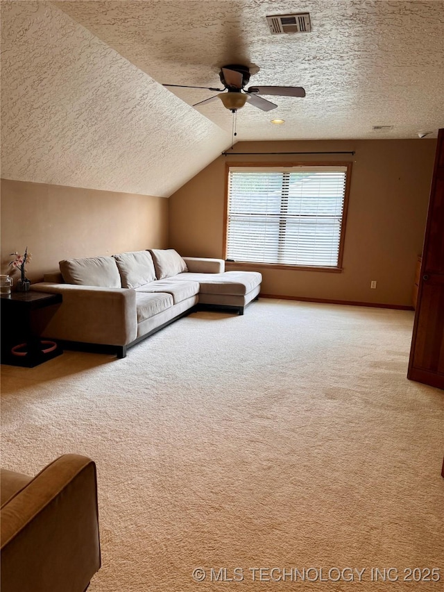 8448 S Florence Ave, Tulsa, OK 74137 - living room featuring a textured ceiling, carpet floors, a ceiling fan, and lofted ceiling