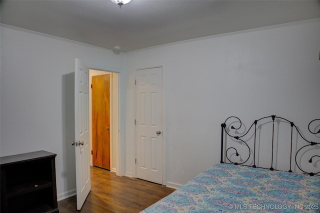 4545 S 30th W Ave, Tulsa, OK 74107 - bedroom featuring dark wood-style floors and ornamental molding