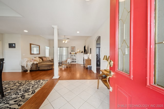 8931 E 62nd Pl, Tulsa, OK 74133 - foyer entrance with decorative columns, recessed lighting, light tile patterned floors, arched walkways, and a ceiling fan