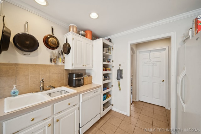 8931 E 62nd Pl, Tulsa, OK 74133 - kitchen featuring white appliances, light tile patterned floors, white cabinetry, crown molding, and light countertops