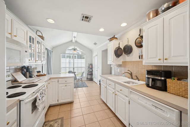 8931 E 62nd Pl, Tulsa, OK 74133 - kitchen featuring white appliances, lofted ceiling, light tile patterned floors, white cabinets, and light countertops