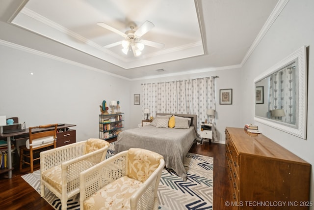 8931 E 62nd Pl, Tulsa, OK 74133 - bedroom with a raised ceiling, dark wood-type flooring, crown molding, and ceiling fan