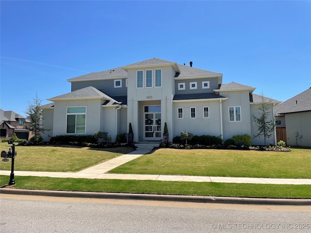 6103 W Charleston Pl, Broken Arrow, OK 74011 - view of front of property with stucco siding and a front yard