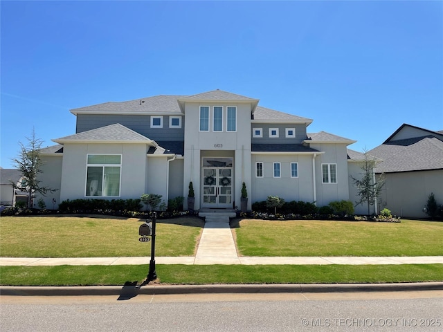 6103 W Charleston Pl, Broken Arrow, OK 74011 - view of front of house featuring stucco siding, a front yard, and a shingled roof