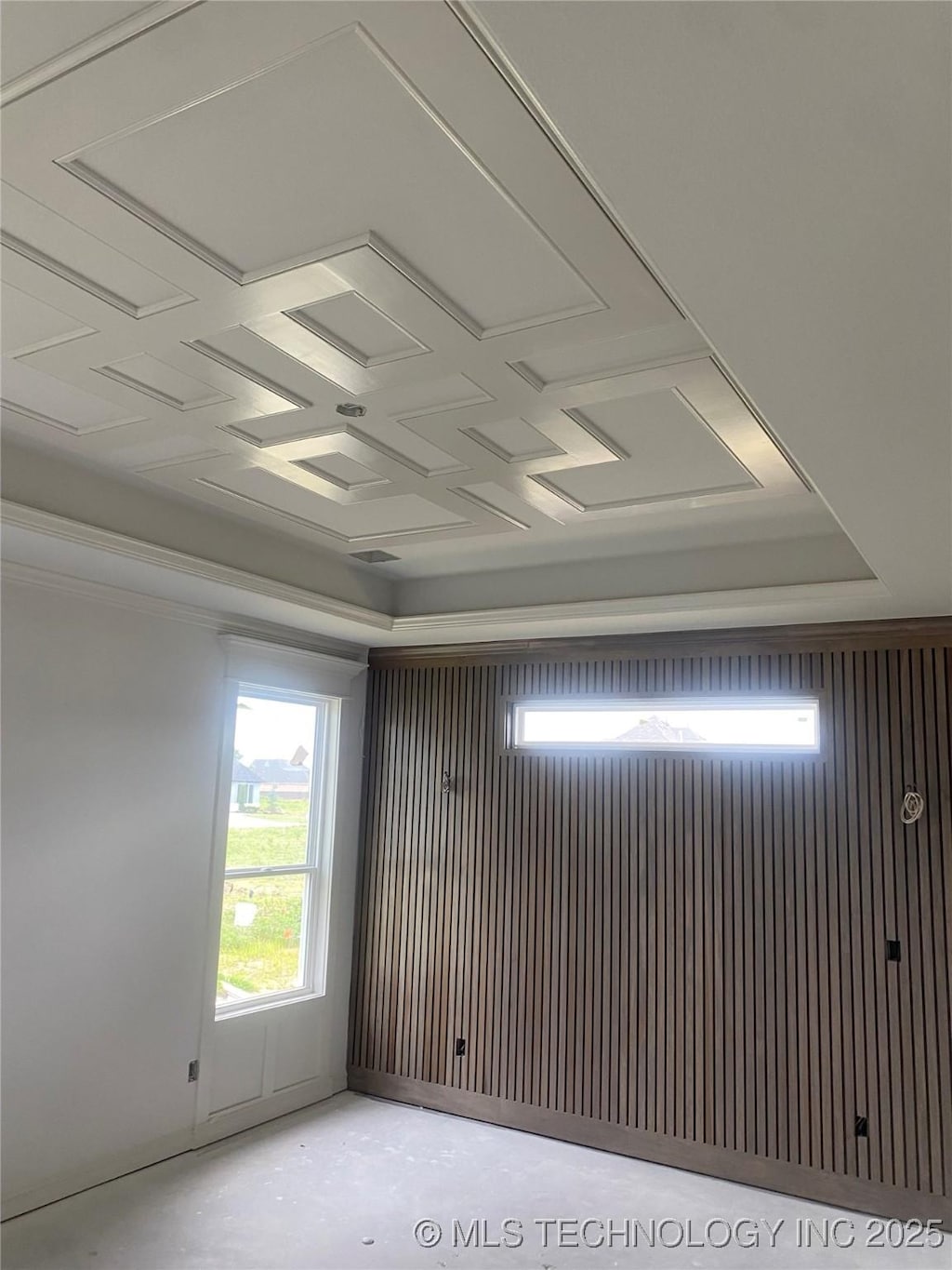 16607 E 41st Pl S, Tulsa, OK 74134 - empty room with healthy amount of natural light and a tray ceiling
