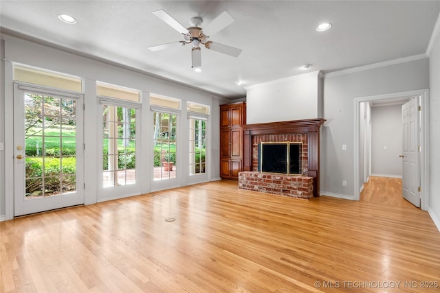 8710 S Vandalia Ave, Tulsa, OK 74137 - unfurnished living room with crown molding, a brick fireplace, light wood-style flooring, recessed lighting, and a ceiling fan
