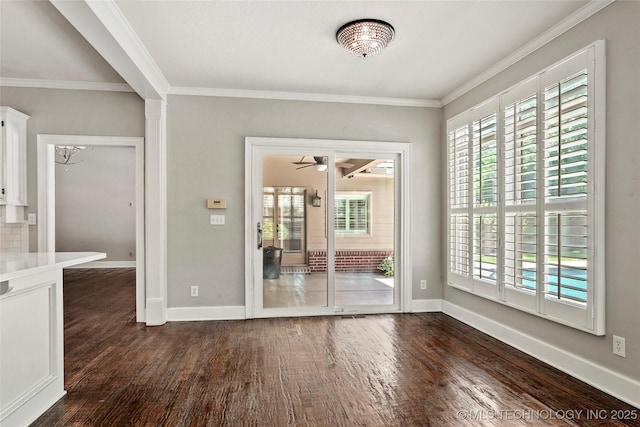 10150 S Maplewood Ave, Tulsa, OK 74137 - unfurnished room featuring dark wood finished floors, healthy amount of natural light, ornamental molding, and a chandelier