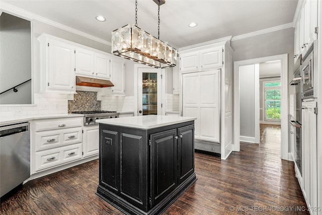 10150 S Maplewood Ave, Tulsa, OK 74137 - kitchen featuring appliances with stainless steel finishes, white cabinetry, dark cabinets, light countertops, and ornamental molding