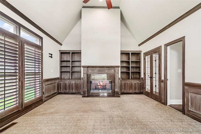 10150 S Maplewood Ave, Tulsa, OK 74137 - unfurnished living room featuring french doors, a fireplace, carpet, high vaulted ceiling, and ornamental molding