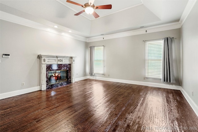 10150 S Maplewood Ave, Tulsa, OK 74137 - unfurnished living room featuring plenty of natural light, ornamental molding, ceiling fan, wood finished floors, and a high end fireplace