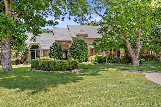 10150 S Maplewood Ave, Tulsa, OK 74137 - view of front of home with a front yard and brick siding