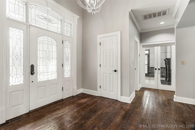 10150 S Maplewood Ave, Tulsa, OK 74137 - foyer entrance with crown molding, dark wood finished floors, a chandelier, french doors, and recessed lighting