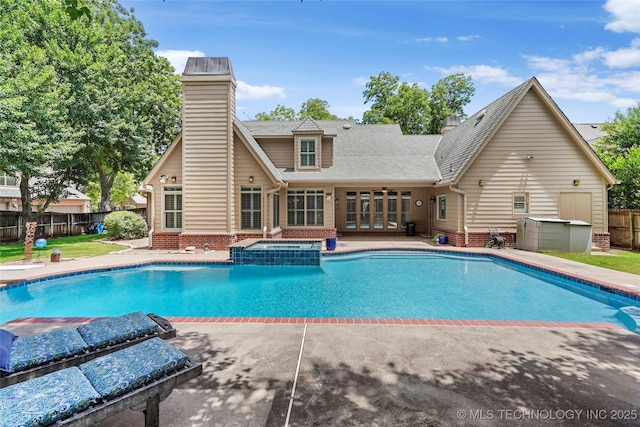 10150 S Maplewood Ave, Tulsa, OK 74137 - view of swimming pool with french doors, a patio area, and a pool with connected hot tub