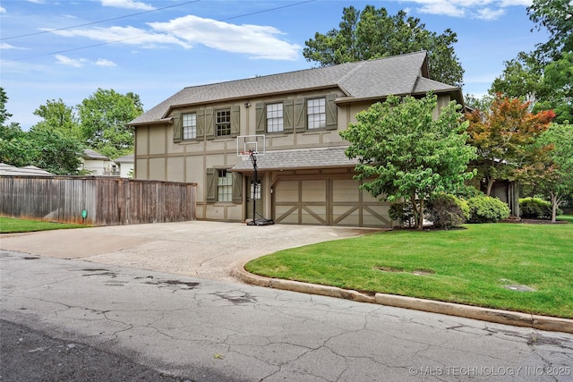1111 E 24th Pl, Tulsa, OK 74114 - tudor home with concrete driveway, stucco siding, a garage, and roof with shingles