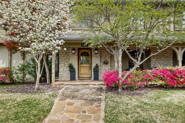1111 E 24th Pl, Tulsa, OK 74114 - view of front of house featuring stone siding and a porch