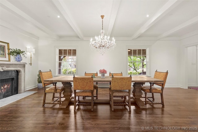1111 E 24th Pl, Tulsa, OK 74114 - dining area with a fireplace, plenty of natural light, beamed ceiling, a chandelier, and wood finished floors