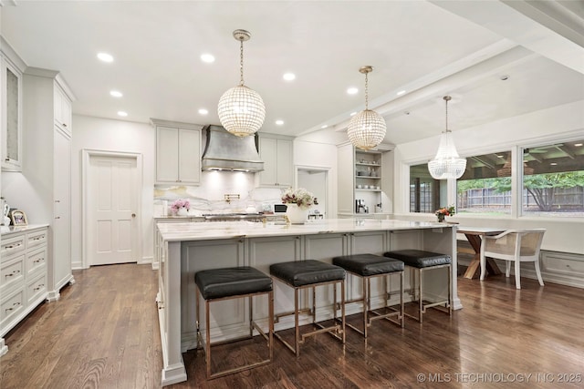 1111 E 24th Pl, Tulsa, OK 74114 - kitchen with custom exhaust hood, recessed lighting, dark wood finished floors, a spacious island, and a kitchen breakfast bar