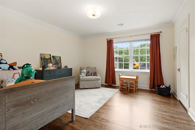 1111 E 24th Pl, Tulsa, OK 74114 - bedroom featuring ornamental molding and wood finished floors