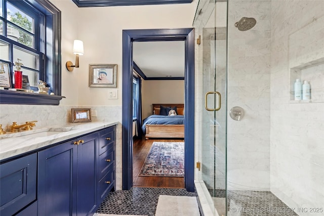 1111 E 24th Pl, Tulsa, OK 74114 - full bathroom with crown molding, a stall shower, connected bathroom, and vanity