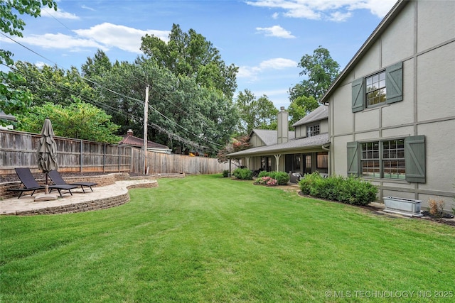 1111 E 24th Pl, Tulsa, OK 74114 - fenced backyard with a patio