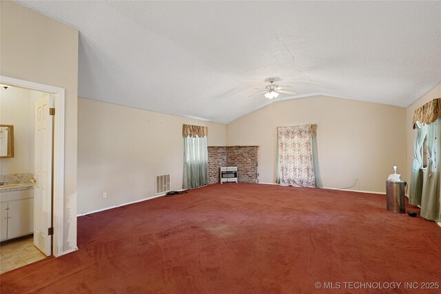 39827 Morris Creek Rd, Howe, OK 74940 - unfurnished living room with ceiling fan, plenty of natural light, vaulted ceiling, and light carpet