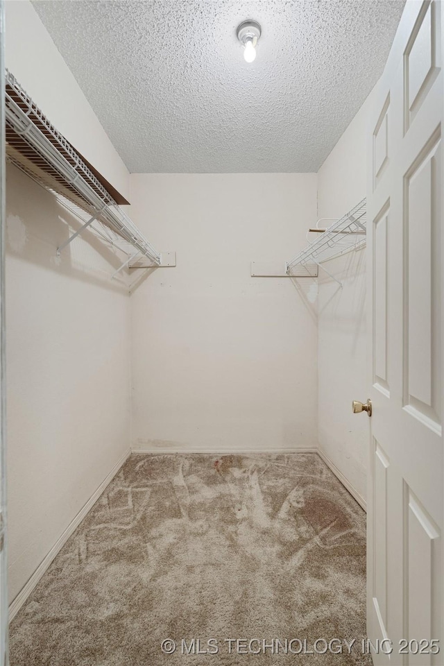 39827 Morris Creek Rd, Howe, OK 74940 - walk in closet featuring carpet