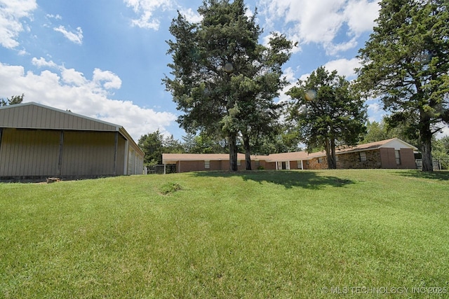 39827 Morris Creek Rd, Howe, OK 74940 - view of grassy yard featuring a pole building and an outdoor structure