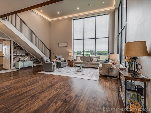20853 S 81st Ave W, Mounds, OK 74047 - living area featuring a high ceiling, healthy amount of natural light, wood finished floors, expansive windows, and stairway
