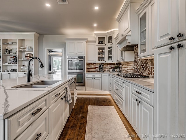 20853 S 81st Ave W, Mounds, OK 74047 - kitchen featuring stainless steel appliances, dark wood-style floors, decorative backsplash, white cabinets, and recessed lighting