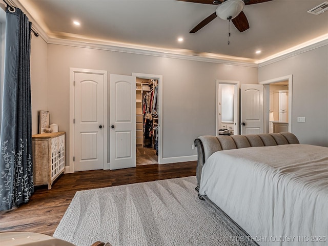 20853 S 81st Ave W, Mounds, OK 74047 - bedroom with crown molding, wood finished floors, a walk in closet, a ceiling fan, and a closet