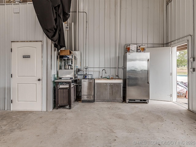 20853 S 81st Ave W, Mounds, OK 74047 - garage featuring freestanding refrigerator and a sink