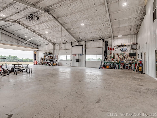 20853 S 81st Ave W, Mounds, OK 74047 - garage with metal wall and a workshop area