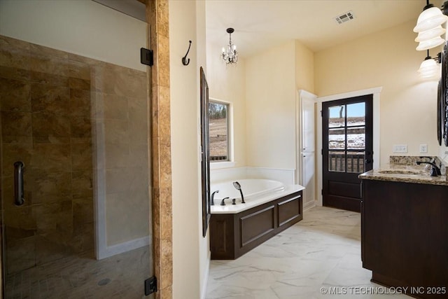 16511 S 4230th Rd, Claremore, OK 74017 - full bath with a stall shower, vanity, a bath, marble look tiles, and a chandelier