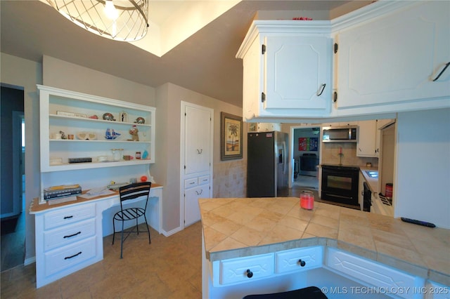 919 S 2nd St, Mcalester, OK 74501 - kitchen with appliances with stainless steel finishes, white cabinetry, open shelves, a peninsula, and built in study area