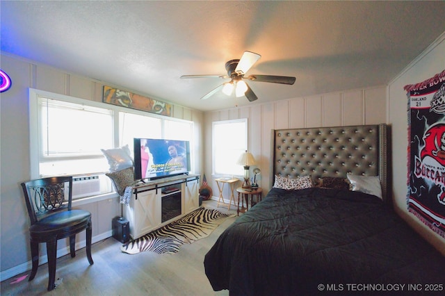 919 S 2nd St, Mcalester, OK 74501 - bedroom with cooling unit, wood finished floors, and a ceiling fan