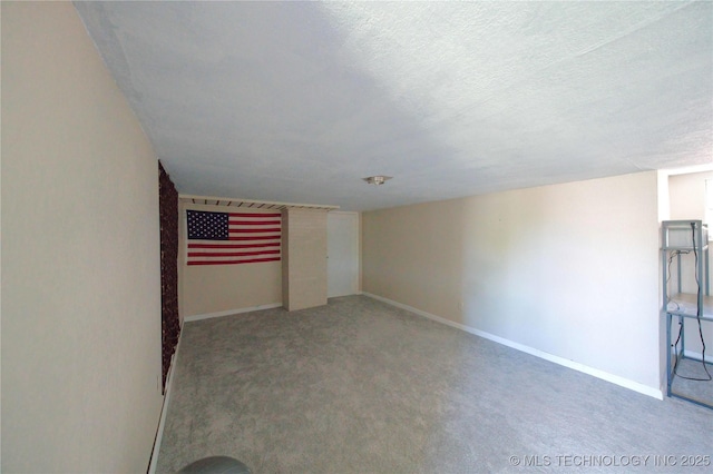 919 S 2nd St, Mcalester, OK 74501 - unfurnished room with carpet and a textured ceiling