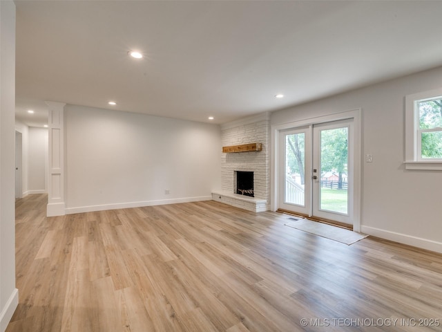 11702 S 75th E Ave, Bixby, OK 74008 - unfurnished living room featuring light wood-style floors, recessed lighting, and a fireplace