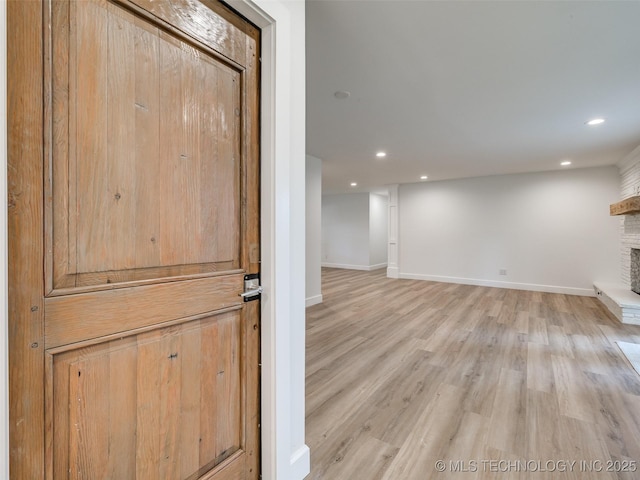 11702 S 75th E Ave, Bixby, OK 74008 - basement with a fireplace, light wood-style flooring, and recessed lighting