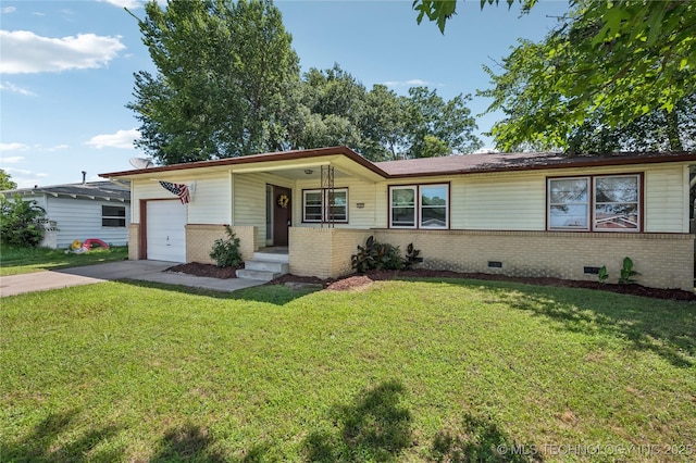 503 N Prairie Ave, Okmulgee, OK 74447 - view of front facade featuring brick siding, driveway, a garage, a front lawn, and crawl space