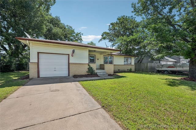 503 N Prairie Ave, Okmulgee, OK 74447 - view of front of home with brick siding, an attached garage, and driveway
