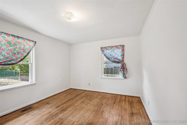 503 N Prairie Ave, Okmulgee, OK 74447 - unfurnished room with wood-type flooring and ornamental molding