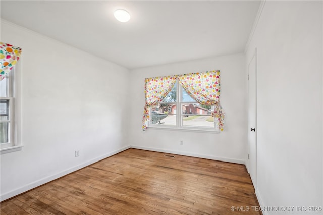 503 N Prairie Ave, Okmulgee, OK 74447 - empty room with wood finished floors and crown molding