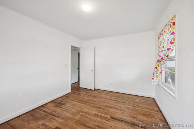 503 N Prairie Ave, Okmulgee, OK 74447 - unfurnished room featuring wood finished floors and baseboards