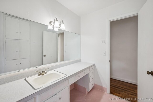 503 N Prairie Ave, Okmulgee, OK 74447 - bathroom with vanity and tile patterned flooring