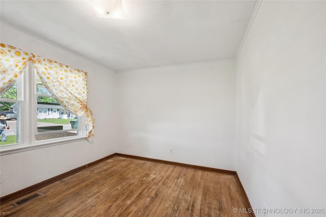 503 N Prairie Ave, Okmulgee, OK 74447 - empty room with hardwood / wood-style flooring and ornamental molding