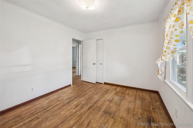 503 N Prairie Ave, Okmulgee, OK 74447 - unfurnished room with wood finished floors and ornamental molding
