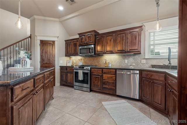 7180 E 179th St S, Bixby, OK 74008 - kitchen with appliances with stainless steel finishes, tasteful backsplash, ornamental molding, hanging light fixtures, and light tile patterned flooring