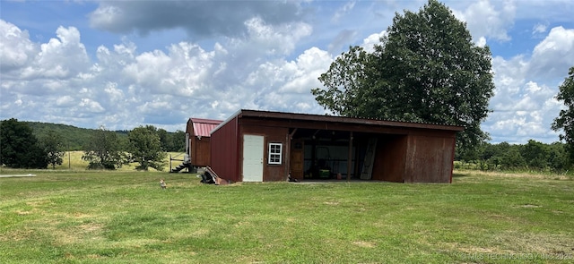 465385 E 981st Rd, Sallisaw, OK 74955 - view of pole building featuring a yard