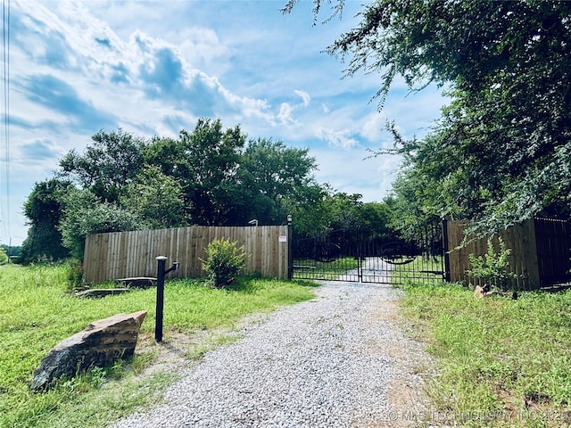 416602 E 1065, Checotah, OK 74426 - view of street featuring a gate and a gated entry